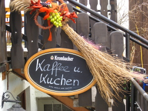 A birch broom, functioning as the vintner's bush, signals the opening of a farmstead tavern in Germany.