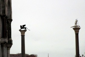 The columns in St. Mark's Sqaure support the winged lion of Venice and a dragon slayer.